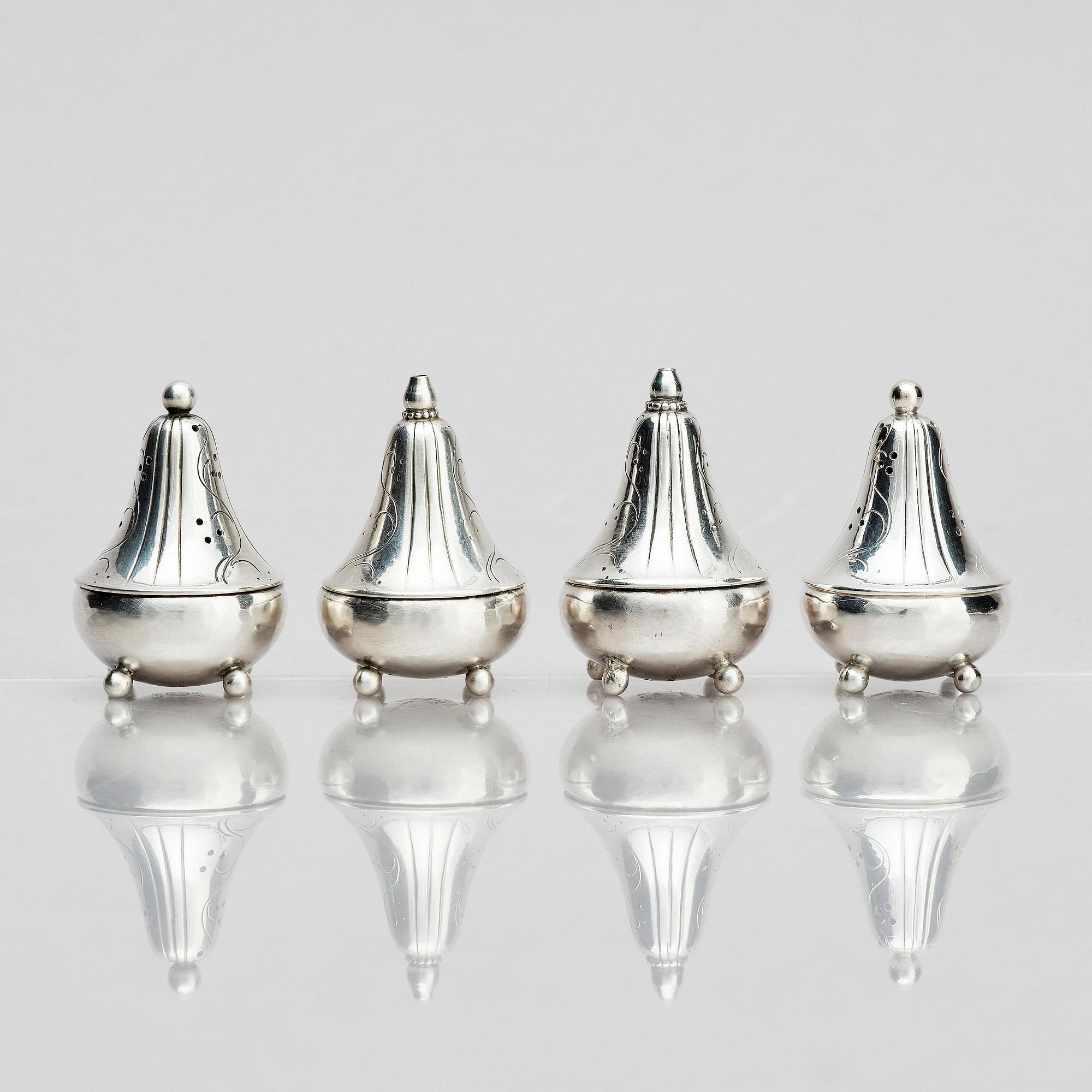 Georg Jensen, four sterling silver casters, design Harald Nilesen, Copenhagen 1933-44, one Copenhagen after 1945.