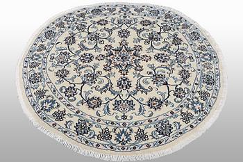 A rug, Nain, part silk, ca 146 x 146 cm.