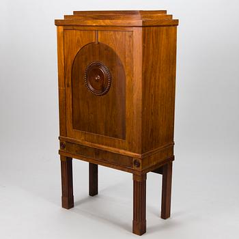 An Art Déco mahogany cabinet.