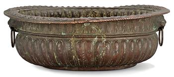 1106. A Baroque copper wine cooler.