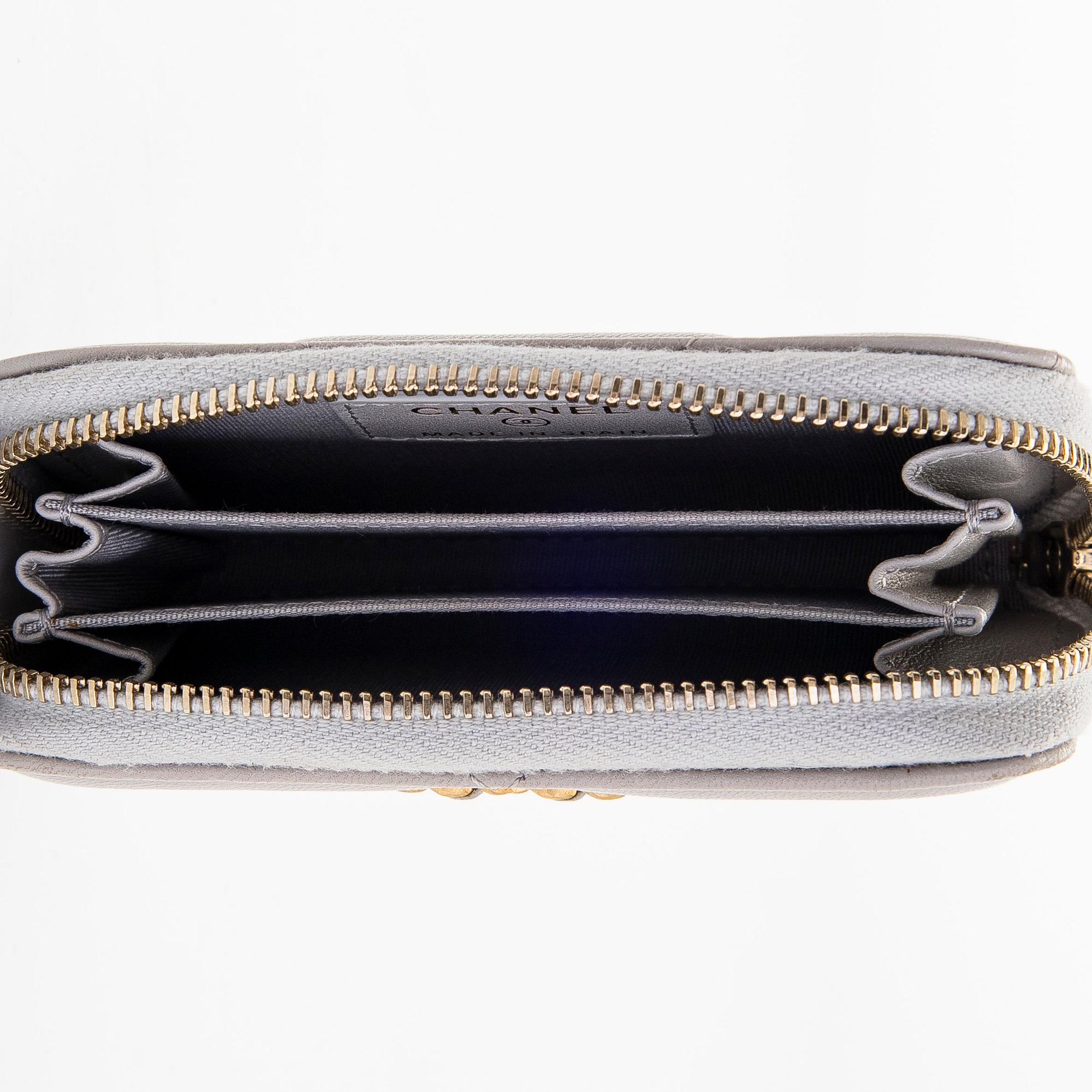 Chanel, A "19 O-coin purse" wallet.
