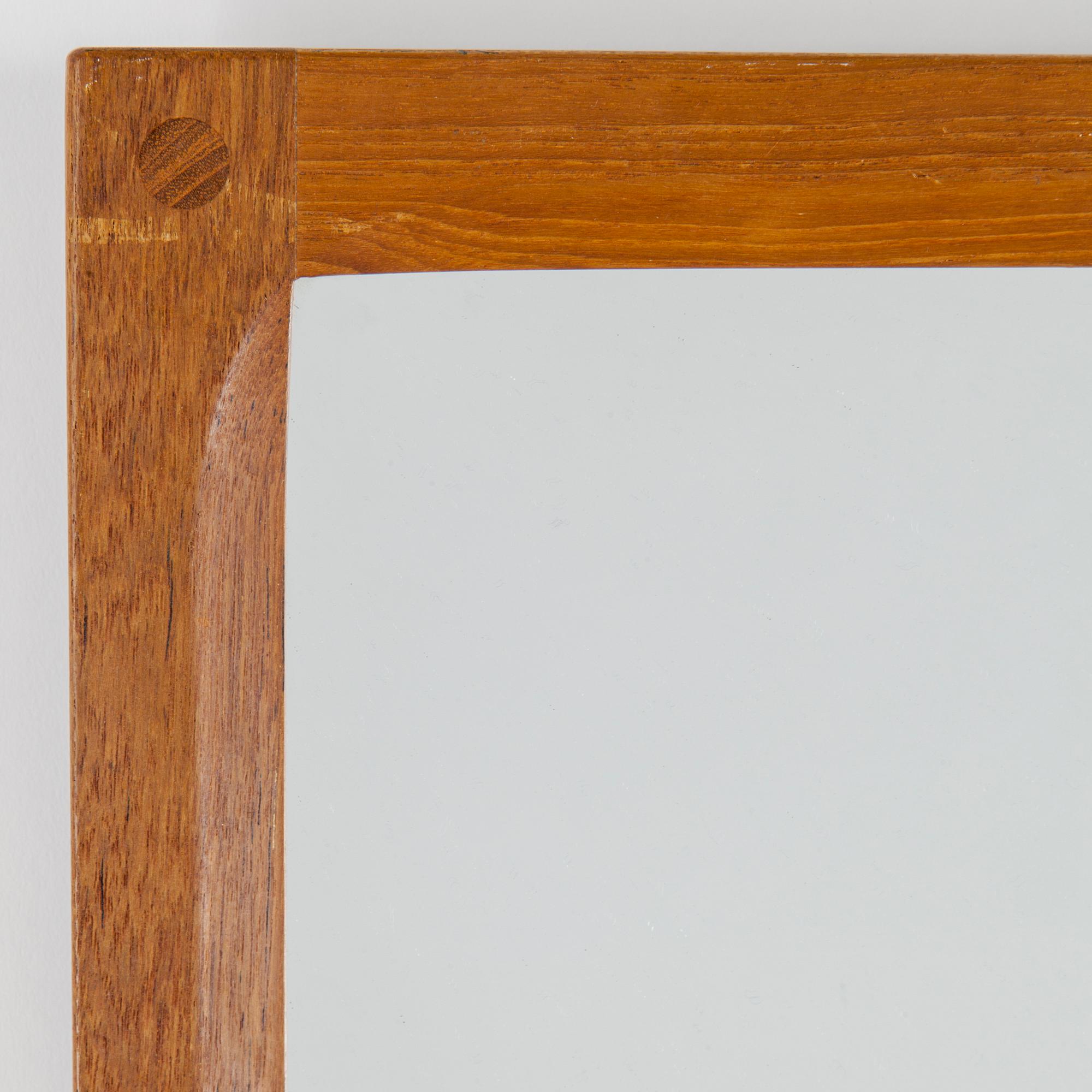 A teak mirror by Aksel Kjersgaard, Odder, Denmark.