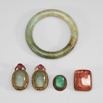 38. A nephrite bracelet, a metal mounted pink tourmaline, two nephrite and paste pendants, and nephrite item, late Qing.
