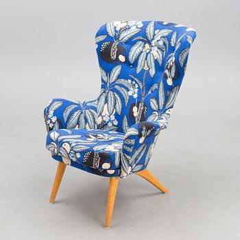 A mid-20th century armchair 'Siesta' manufacturer  Puunveisto Oy - Träsnideri Ab, Finland.