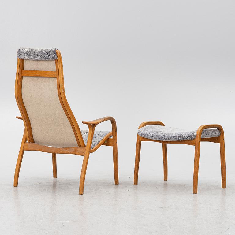 Yngve Ekström, a 'Lamino' armchair with ottoman and sidetable, Swedese, Sweden, 21st century.