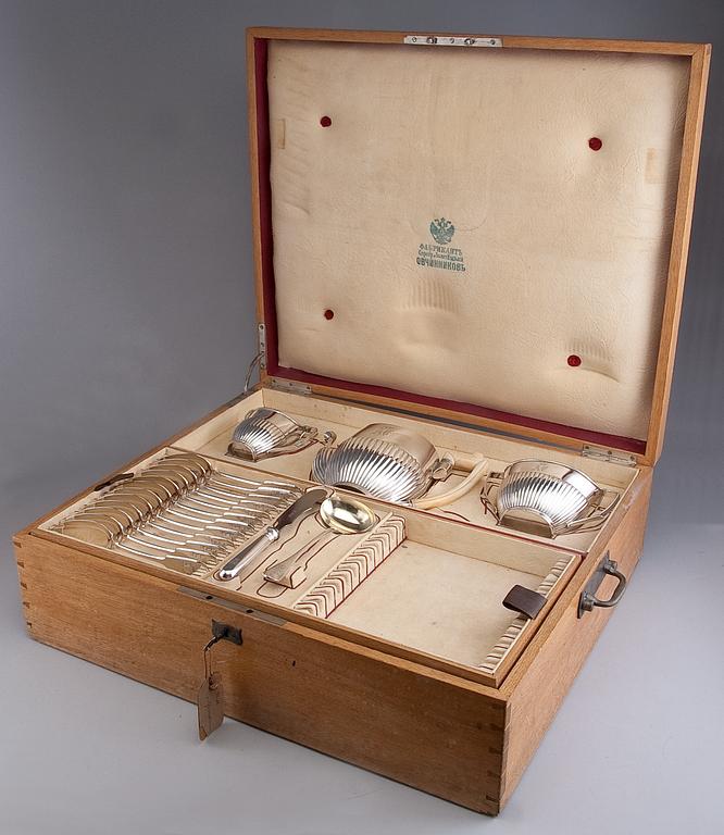 CHEST WITH SILVER / A COFFEE SERVICE "OVTCHINNIKOV", 77 PIECES.