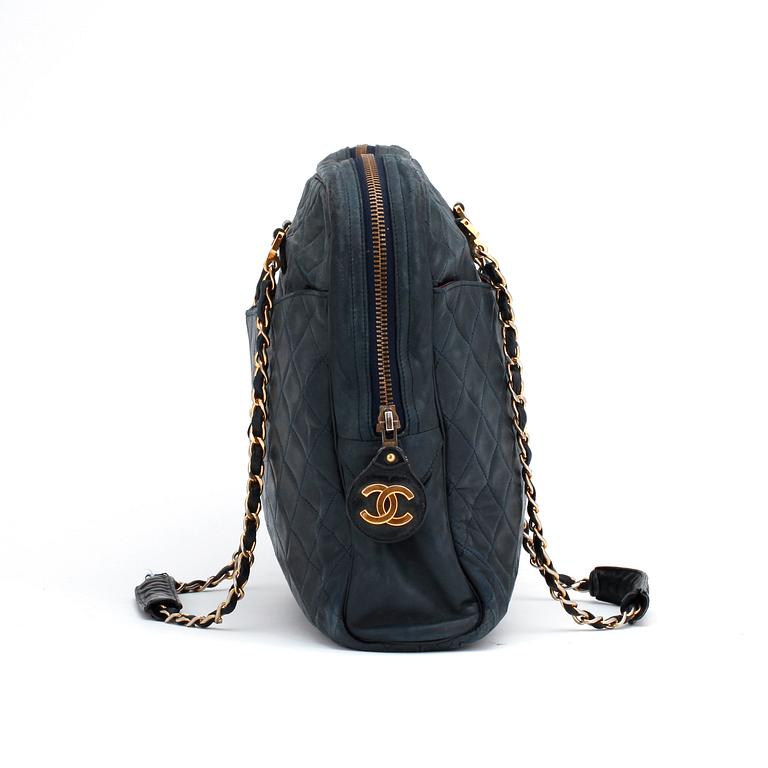 CHANEL, a darkblue leather shoulder bag, 1980s.