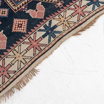 A Caucasian rug, c. 320 x 160 cm.