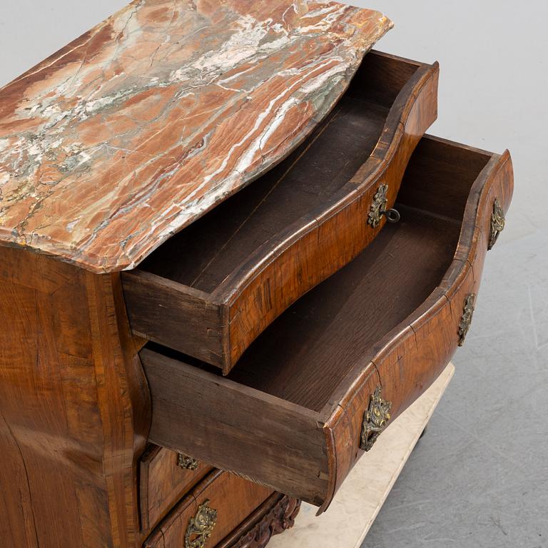 A 19th Century rococo style chest of drawers.