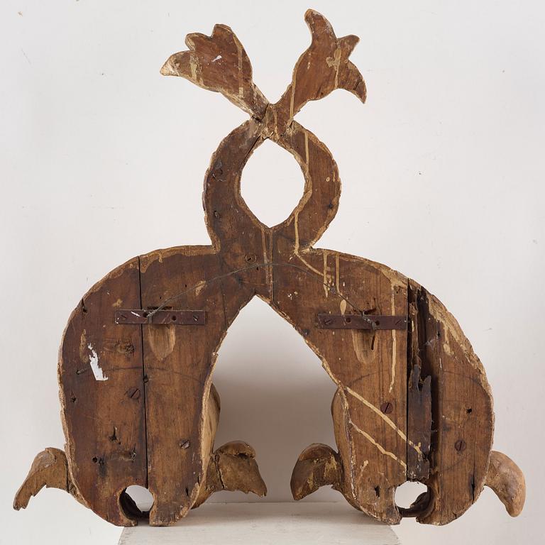 A pair of wooden beer dolphins, circa 1800.