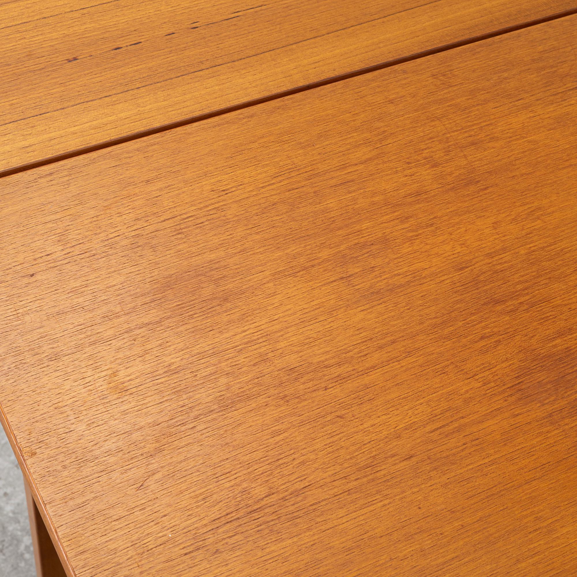 A mid20th century dining table.