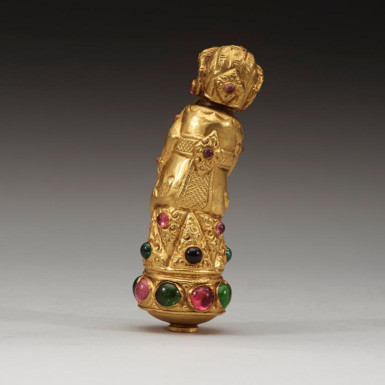 A low content chased gold Kris handle in the shape of Bima, Java or Bali, presumably 19th Century.