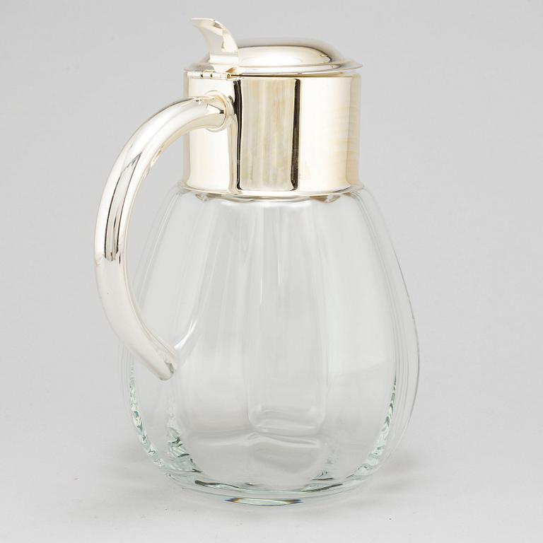 A glass and metal jug, second half of the 20th century, purchased from Firma Svenskt Tenn.