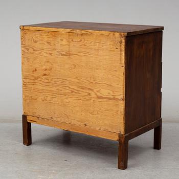 AXEL EINAR HJORTH, an attributed, stained pine chest of drawers, 1930's.