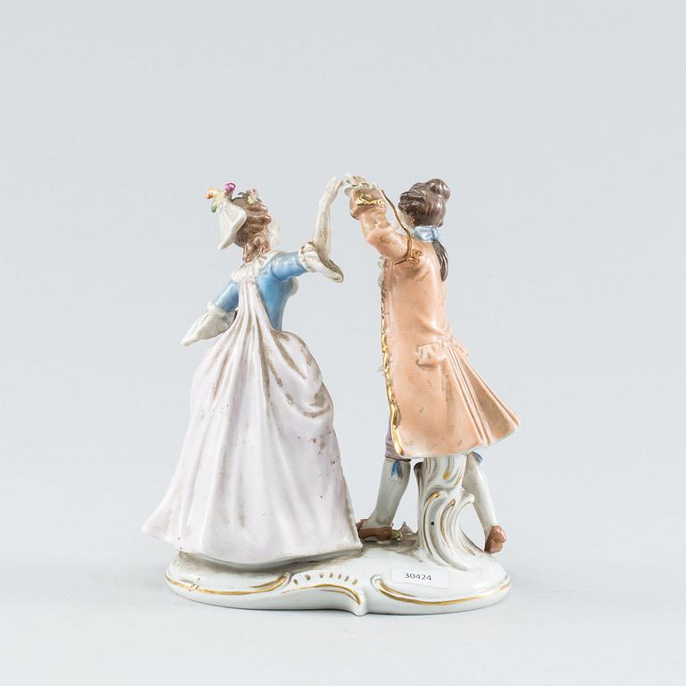 A Rococo style porcelain figure group. First half of the 20th Century.