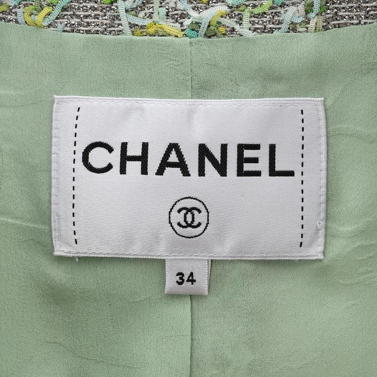 Chanel, a green and silver bouclé jacket, 2018, French size 34.