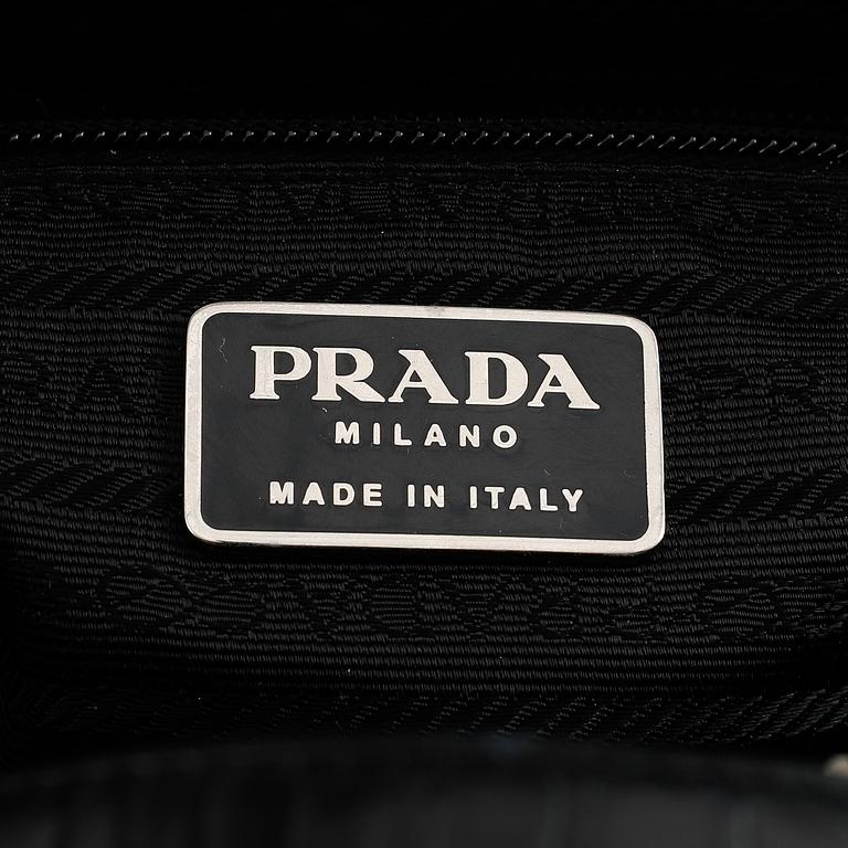 Prada, a patent leather bag.