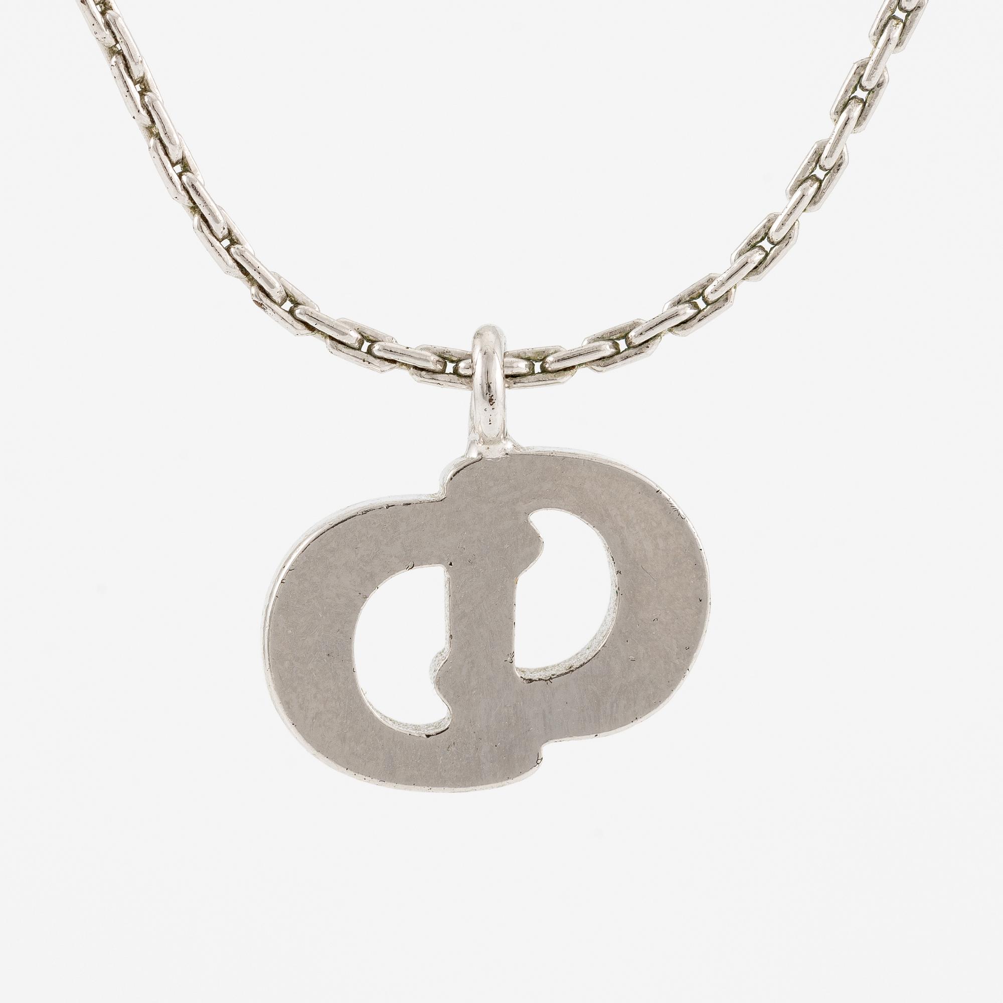 Christian Dior, örhängen, ett par och collier med hänge.