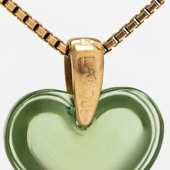 A Lalique heart pendant with an 18K gold chain.