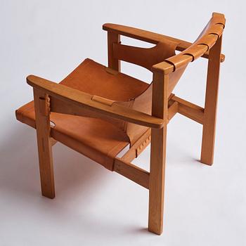 Carl-Axel Acking, an oak and brown natural leather 'Trienna' chair, Nordiska Kompaniet, Sweden.