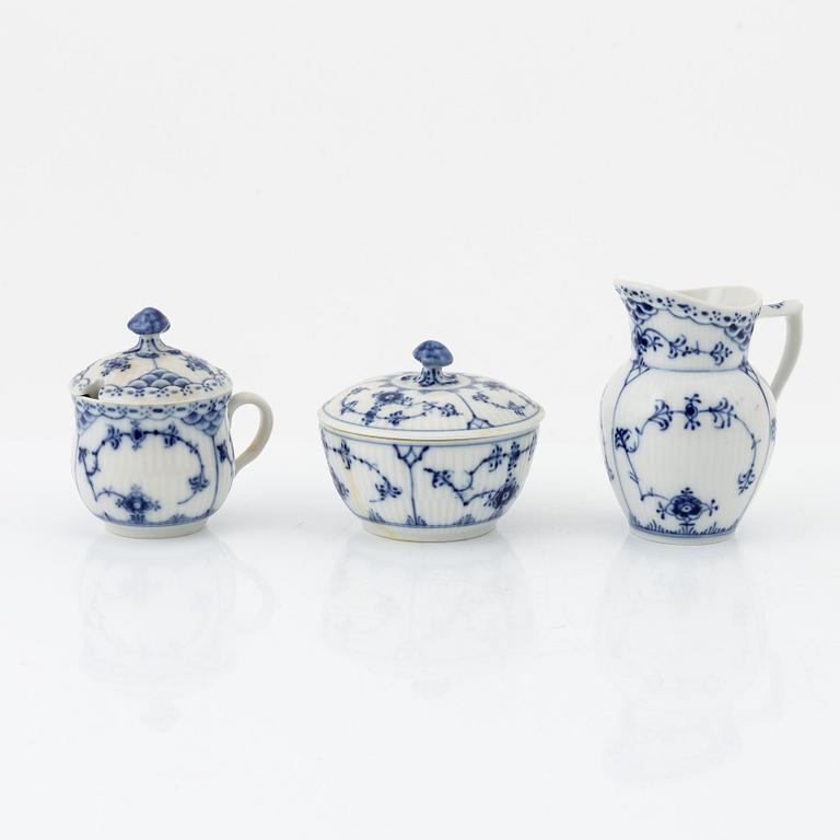A 24-piece 'Musselmalet' tea service, Rifflet and half lace, Royal Copenhagen, Denmark.