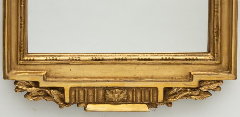 A Gustavian style mirror, mid-20th century.