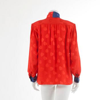 YVES SAINT LAURENT, a red silk blouse, size 40.