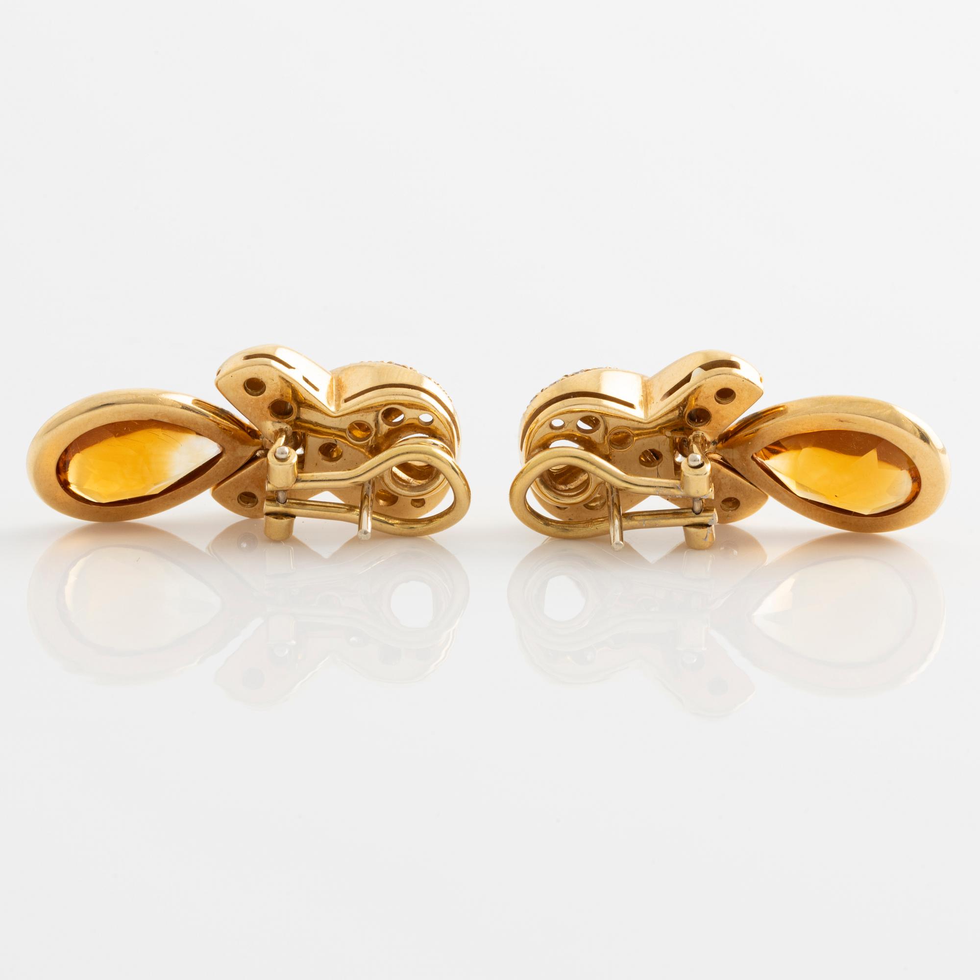 Earrings with pear-shaped citrines and brilliant-cut diamonds.