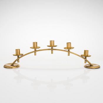 A mid-20th century brass candle holder, Idman.