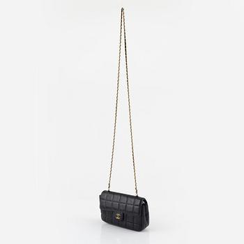 Chanel, a chocolate bar quilted black leather 'East West' crossbody bag.