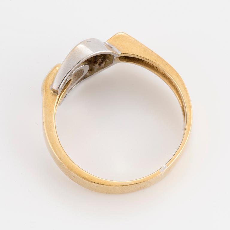 An 18K gold and white gold ring.