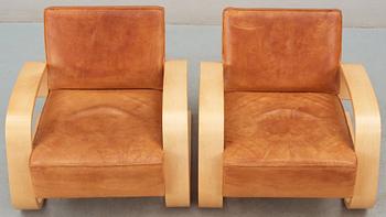 A pair of Alvar Aalto 'Nr 400' elk skin and birch armchairs, Artek, Finland.