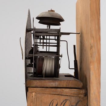 a painted grandfather-clock from the first half of the 19th century.