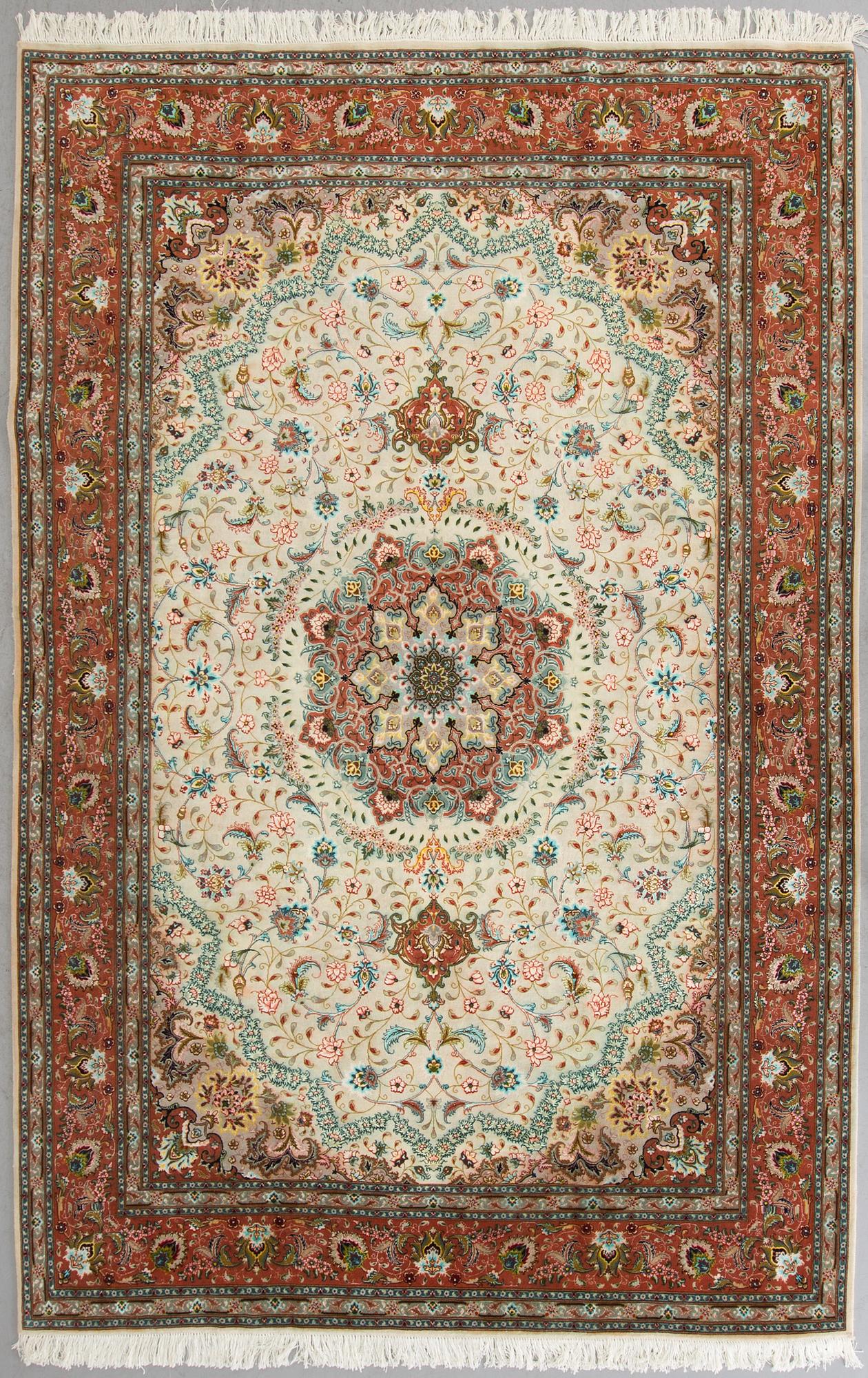 A carpet from Tabriz, part silk, ca 289 x 200 cm.