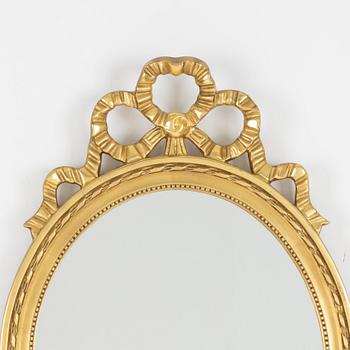 A Gustavian style mirror, mid 20th century.