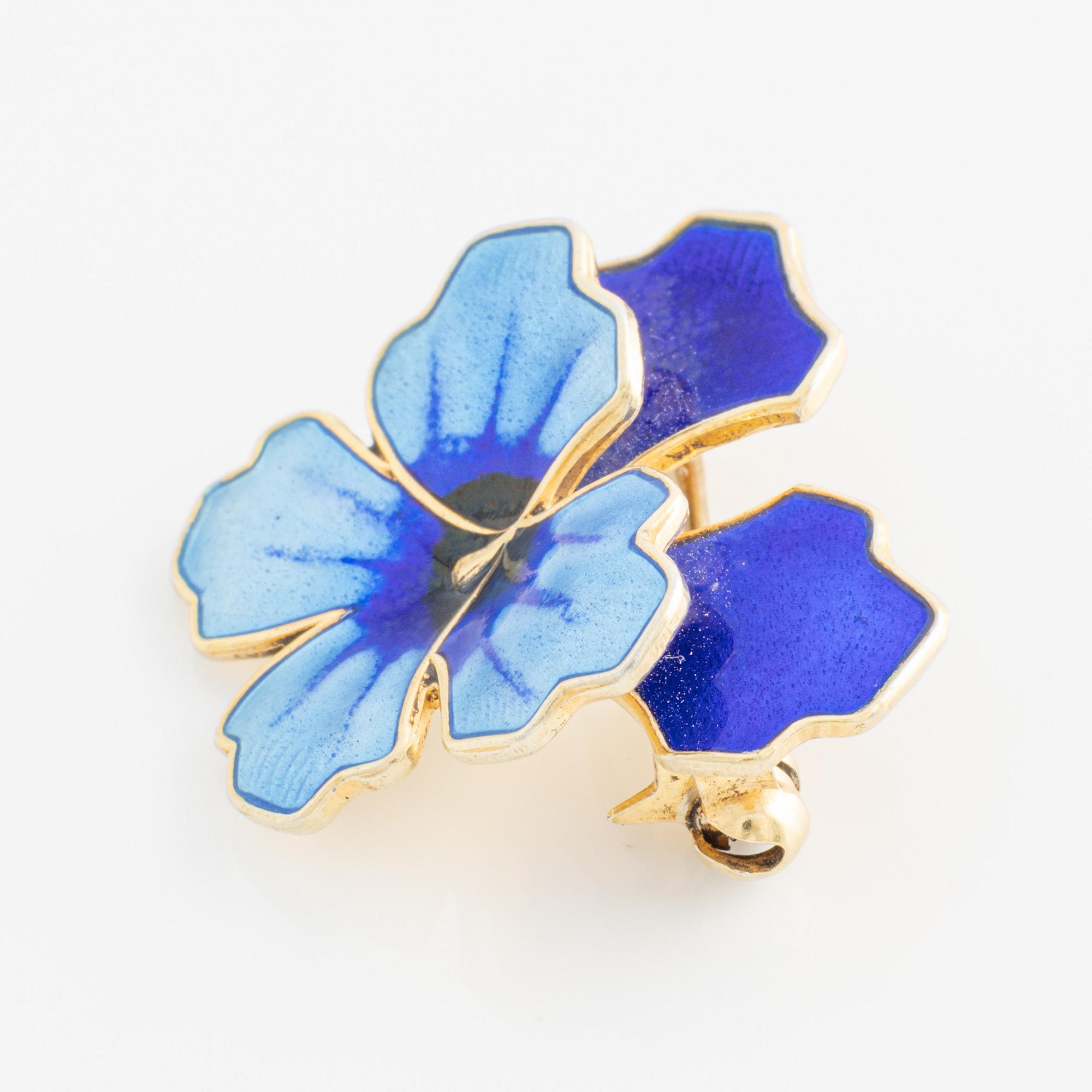 David Andersen, bracelet and two brooches, gilded silver and enamel, Norway.