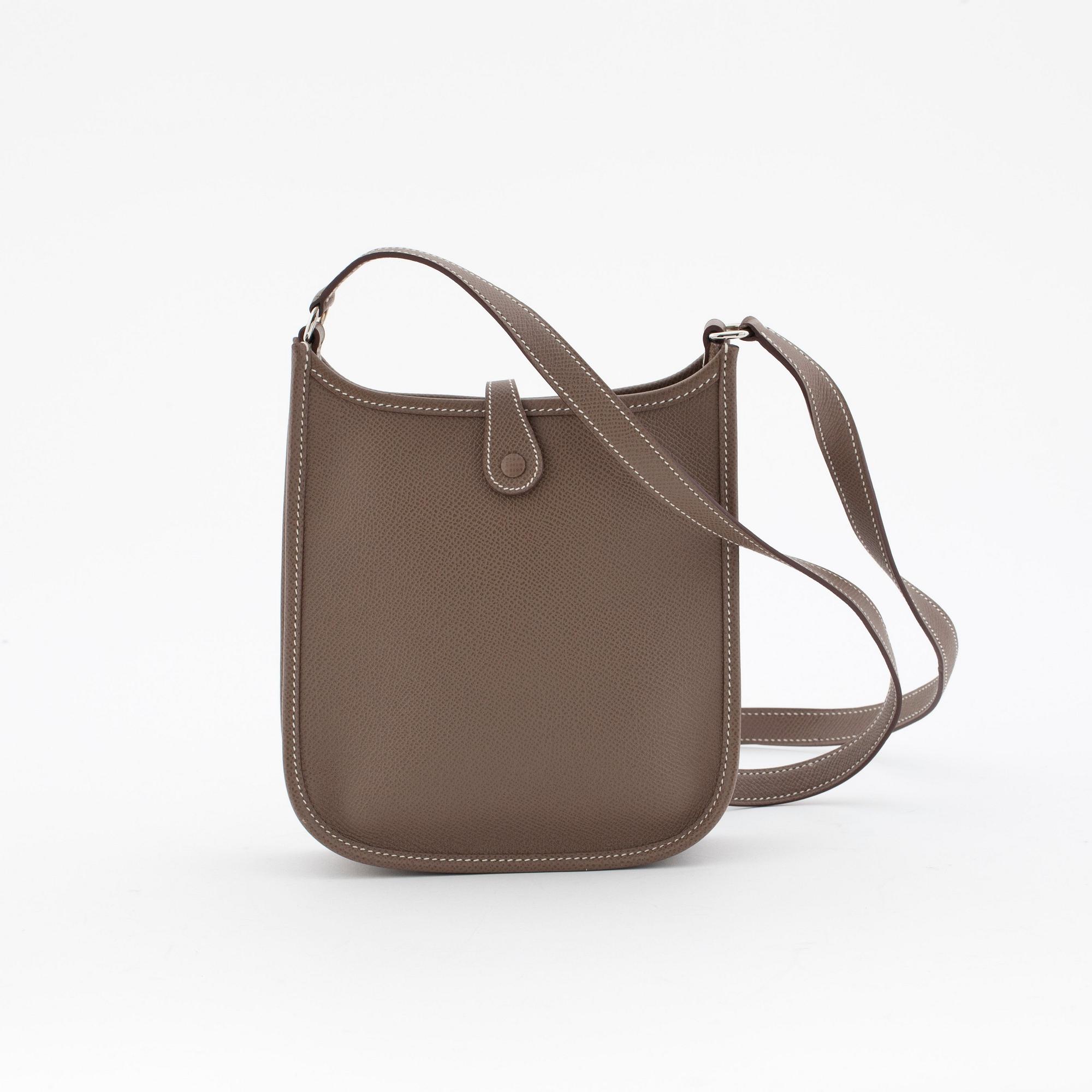 HERMÈS, a small veau epsom etoupe shoulderbag and card case, "Evelyne tpm".