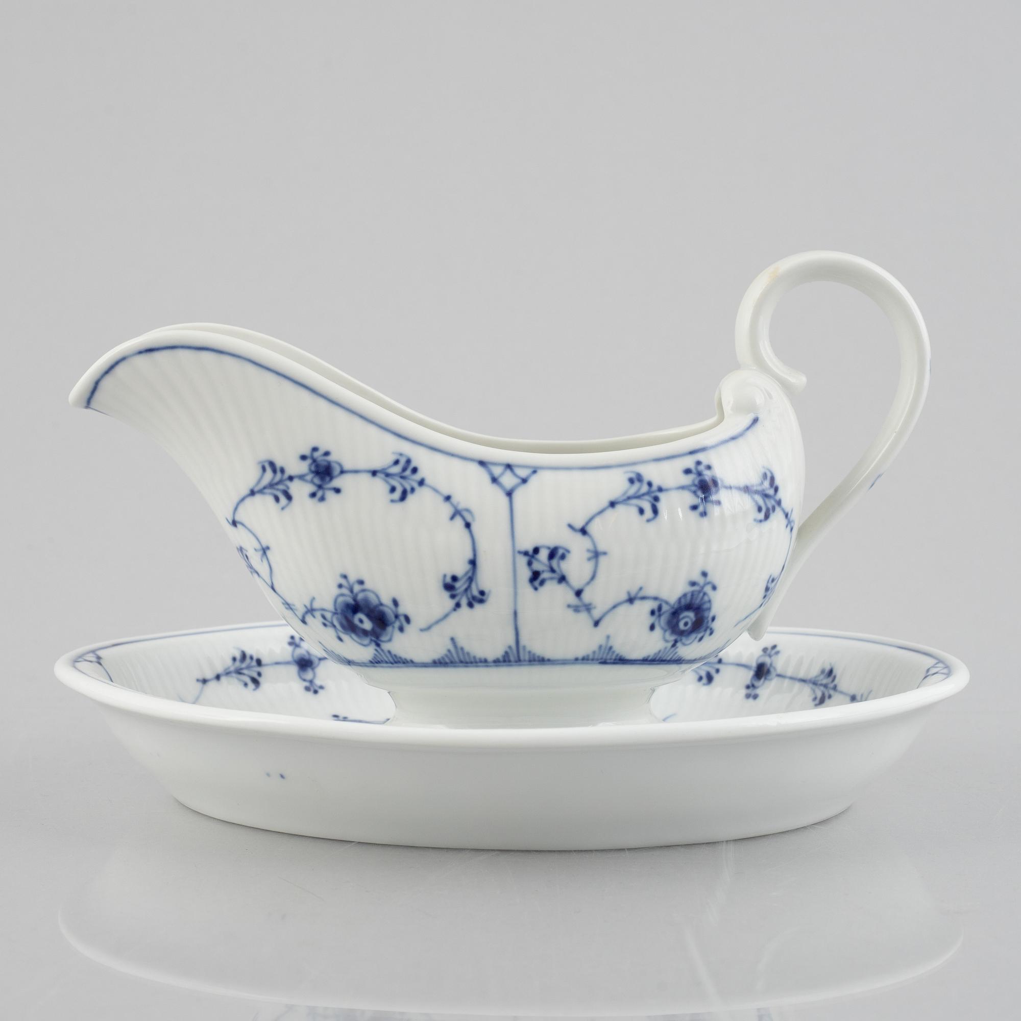A 'Blue Fluted Plain' /'Musselmalet' sauce boat with stand, Royal Copenhagen, model 406 and 409, 1963 and 1893-1900.