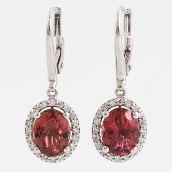 Oval faceted pink tourmaline and brilliant-cut diamond earrings.