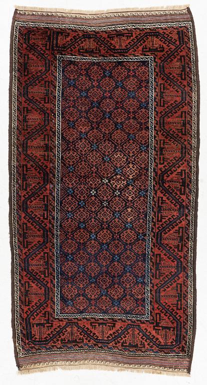 A semi-antique rug, baluch, including flat weave ca. 216 x 110 cm.