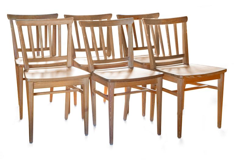 A SET OF SIX PINE DINNER CHAIRS.