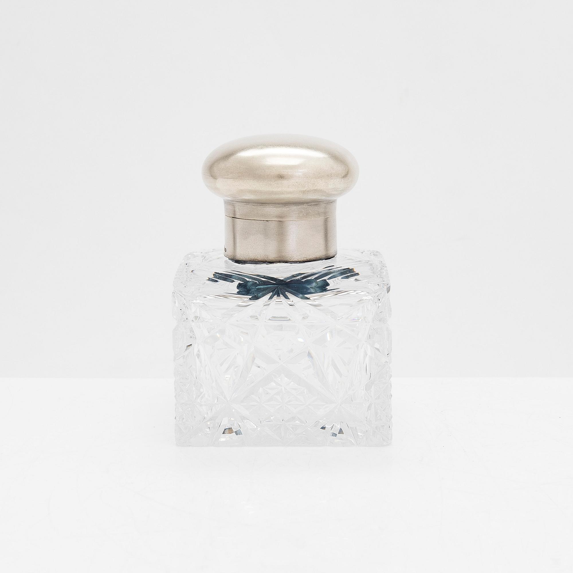 A silver and glass inkwell and eight pieces of silver cutlery, Latvia and Estonia, mid-19th century and 1924-44.