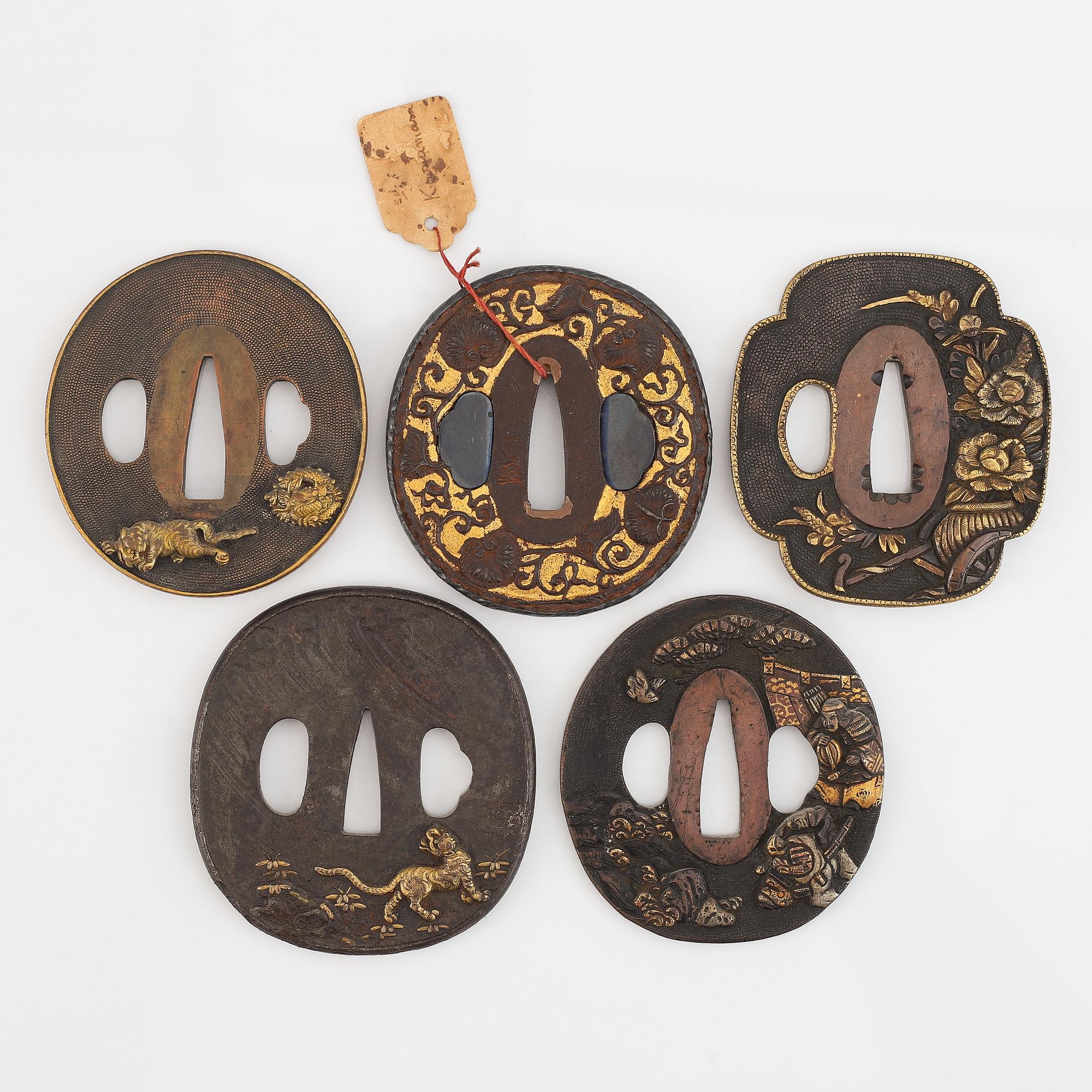 Five tsubas, 18/19th Century, one signed.