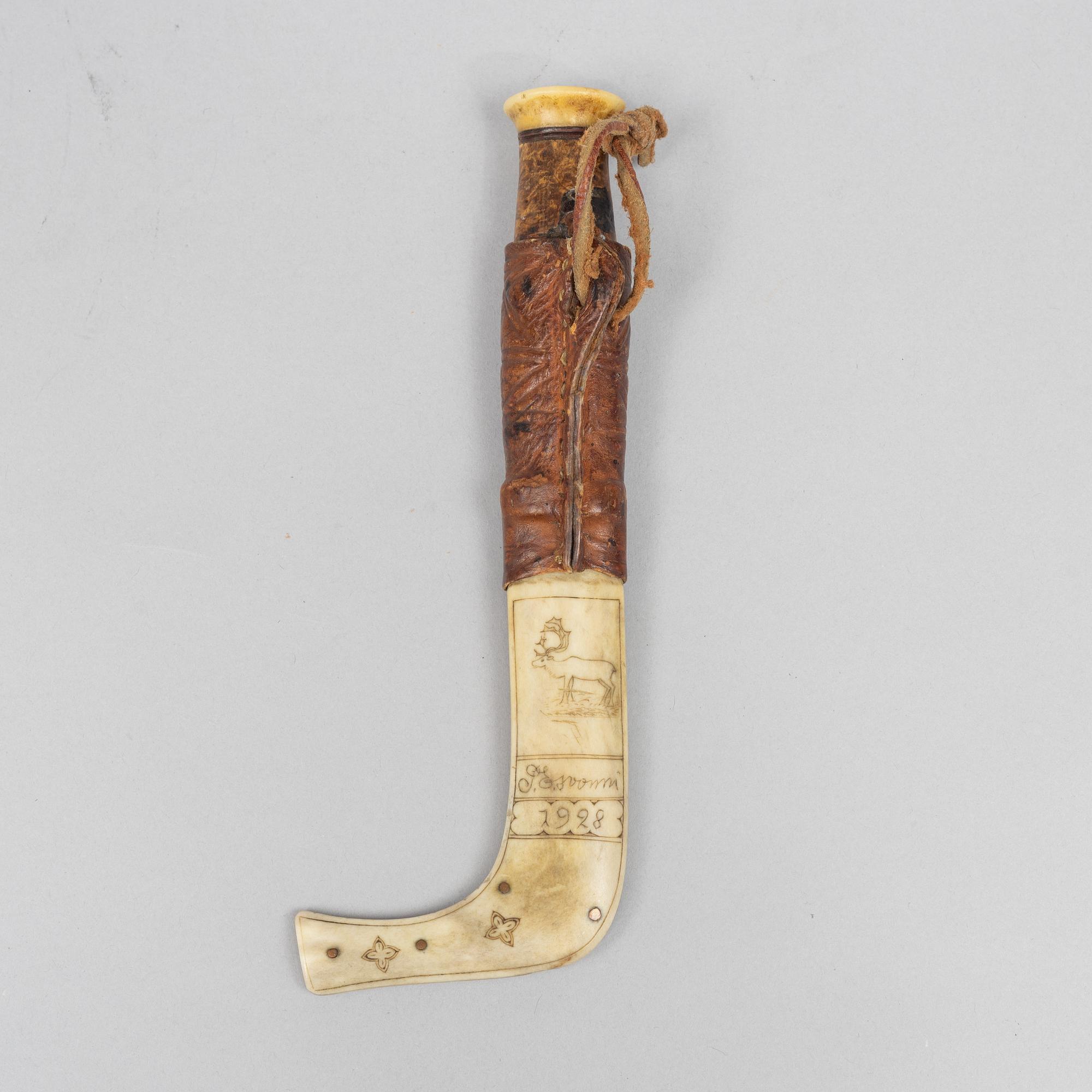 Per Erik Svonni, a reindeer horn knife, signed and dated 1928.