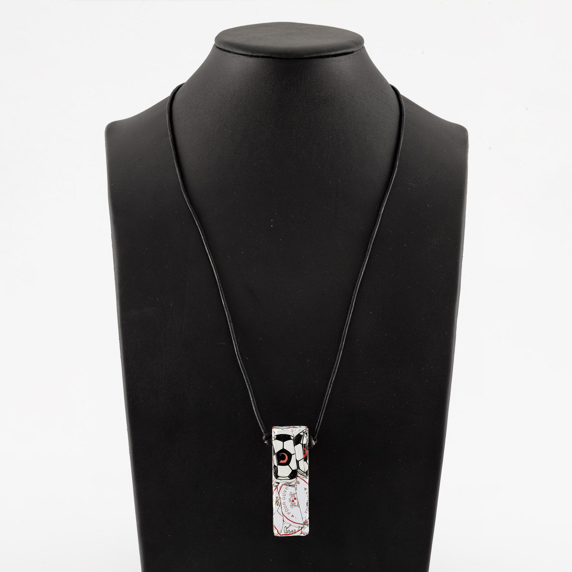 César Baldaccini, compression, pendant made of compressed beer bottle caps.