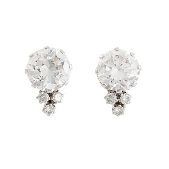 577. A pair of 18K white gold earrings set with two round brilliant-cut diamonds, probably made by WA Bolin.