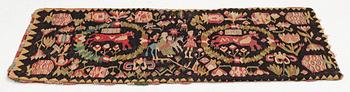 A Scania carrige cushion, 'Flykten till Egypten', tapestry weave, c. 98 x 47 cm, Oxie district, signed BAD 1821.