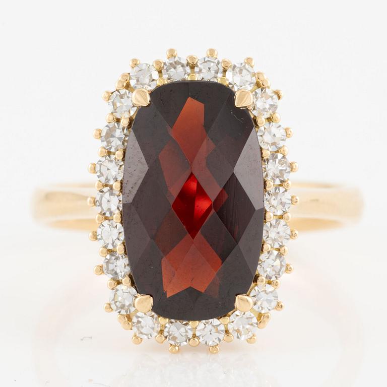 Ring with checkerboard-cut garnet and octagon-cut diamonds.