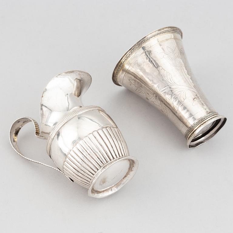 A silver creamer, beaker, and platter, Sweden, 18-19th century.