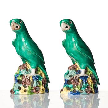A pair of green glazed parrots, late Qing dynasty.